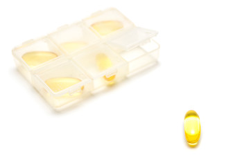 Pill and pill bottle on white background :medical concept