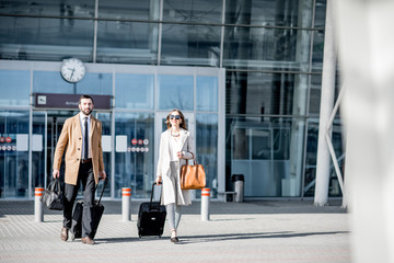 Business couple leaving the airport