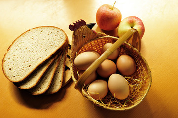 Natural chicken eggs. Fresh chicken eggs in wicker basket on the table in the kitchen.