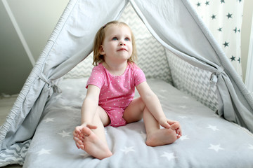 Cute 2 years little girl in wigwam tent © ivolodina