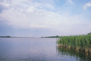 Fototapeta premium Landscape lake. Texture of water. The lake is at dawn. The mouth