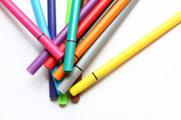 Naklejka premium Color pen. Pile with color pens isolated on white background. Color background texture, felt-pen activity. Children school fun time. Students painting time. School supplies. Drawing supplies. No sharp
