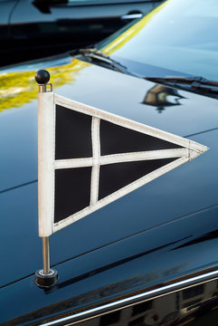 Official flag on a Dutch funeral car