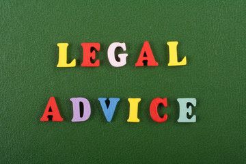 LEGAL ADVICE word on green background composed from colorful abc alphabet block wooden letters, copy space for ad text. Learning english concept.
