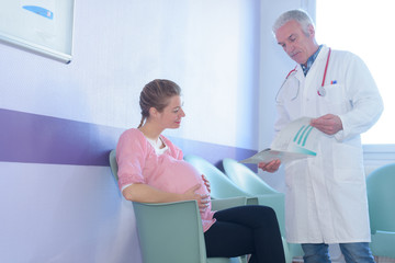 pregnant woman looking at her ultrasound baby results