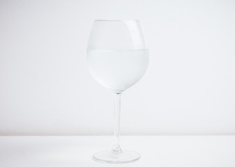 Cold water in glass on the rustic background. Selective focus.
