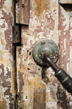 old, shabby door with an old door handle