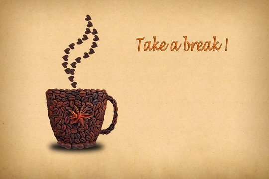 Fototapeta Creative concept photo of a cup of coffee and hearts  made of coffee beans.  Inscription  "Take a break!"