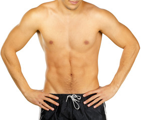 Fototapeta premium Topless young man bodybuilder posing isolated on white background