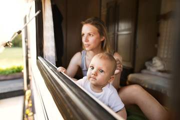 Mother and baby son in a camper van.