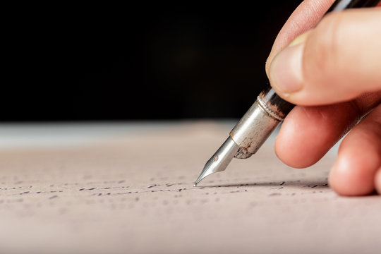 Fountain pen on an antique handwritten letter
