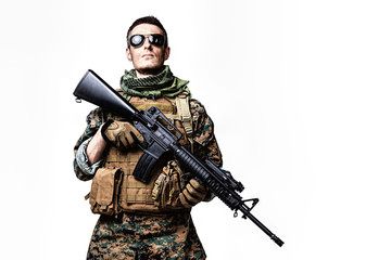 Studio shot of United States Marine with rifle weapons in uniforms. Military equipment, army helmet, combat boots, tactical gloves. Isolated on white, weapons, army, patriotism concept