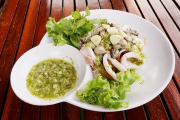 fresh spicy seafood on white plate