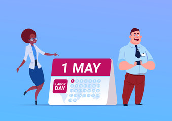 Happy 1 May Labor Day Poster With Business Man And Woman Over Calendar Flat Vector Illustration