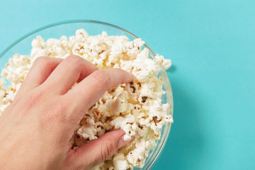 popcorn on color background