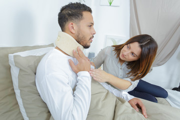 man with neck problem and girlfriend