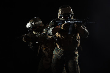 Studio shot of United States Marine with rifle weapons in uniforms. Military equipment, army helmet, combat boots, tactical gloves. Isolated on white, weapons, army, patriotism concept