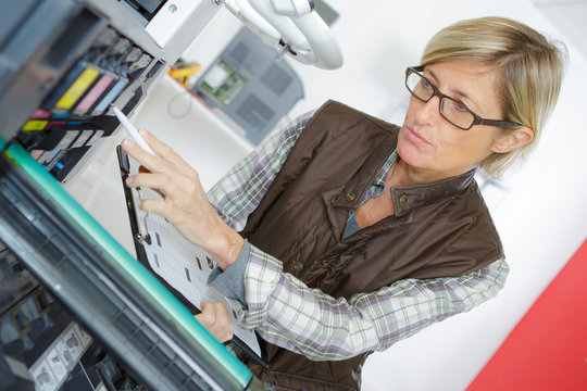 woman on printer maintenance