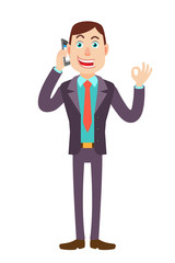 Businessman talking on mobile phone and showing a okay hand sign