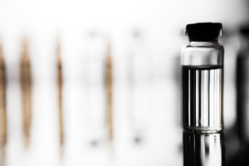 Group of ampoules with a transparent medicine in medical laboratory
