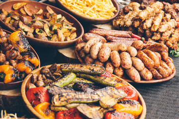 Grilled vegetables and fried sausages, a festival of sweet street food.