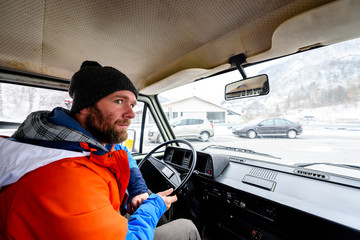 Interior view of delivery man driving a van or truck.