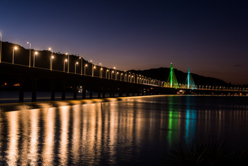 Fototapeta na wymiar Anita Garibaldi bridge at dusk and illuminated