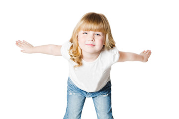 Obraz na płótnie Canvas Funny little girl in jeans and white t-shirt joy with the raised hands looking at camera over white background 