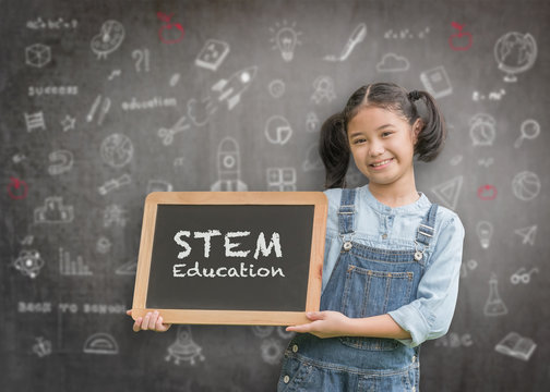 STEM Education on school teacher's classroom chalkboard with smart girl kid student holding blackboard for science, technology, engineering, mathematics educational learning system