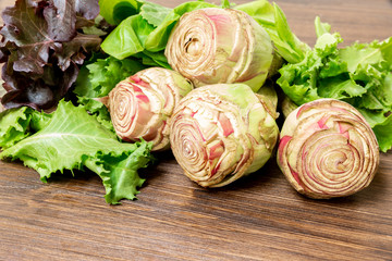Artichokes garnished with salad ready to be eaten, both cooked and raw