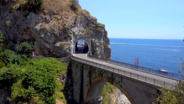 famous picturesque road viaduct over sea water of Amalfi coast, Italy