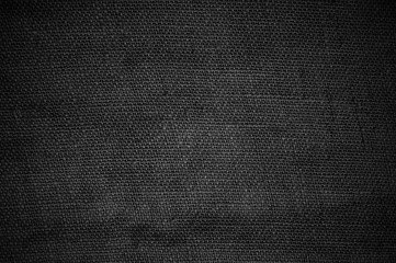 Fototapeta na wymiar Dunkler schwarz grauer Stoff als Hintergrund