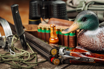 Hunting equipment on the wooden background. Hunt concept.