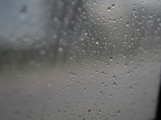 Rain drop on the car glass background, the heavy rainy