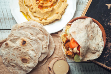 Falafel with humus and tahini in pita