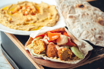 Falafel with humus and tahini in pita