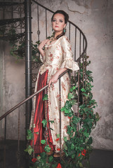 Beautiful woman in old historic medieval dress