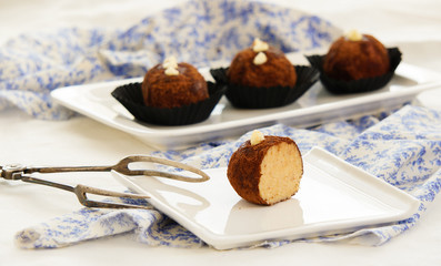 russian cake Kartoshka chocolate truffle potatoes. Rum balls of vanilla biscuit with cocao powder, butter cream and nuts 
