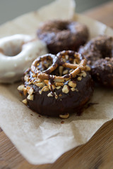 donuts with chocolate, nuts and pretzels