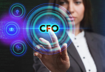 The concept of business, technology, the Internet and the network. A young entrepreneur working on a virtual screen of the future and sees the inscription: CFO