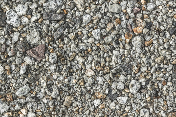 background texture. small gray pebbles on the ground.