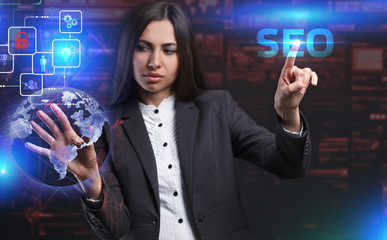 The concept of business, technology, the Internet and the network. A young entrepreneur working on a virtual screen of the future and sees the inscription: SEO