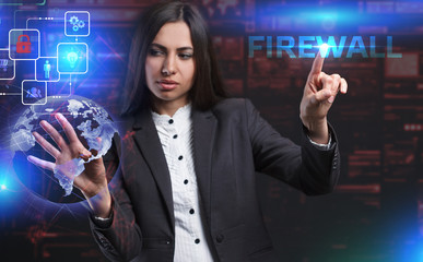 The concept of business, technology, the Internet and the network. A young entrepreneur working on a virtual screen of the future and sees the inscription: Firewall