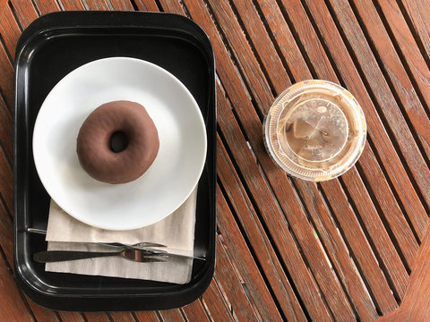 Chocolate dougnuts served with iced coffee