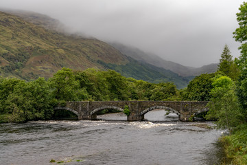 Fototapeta na wymiar Bridge over the Gearr Abhainn river at the Old Military Road, Highlands Scotland