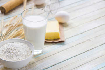 Ingredients for baking: milk, flour, egg and butter