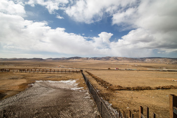 Naklejka premium View of land, mountain and cloudy sky outside the city of Ulaanbaatar, Mongolia