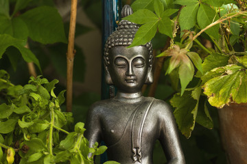 Buddha decorative statue in a green garden