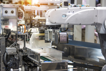 Industry 4.0 Robot concept .The robot arm is working smartly in the shipping department of the factory.