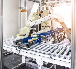 Industry 4.0 Robot concept .The robot arm is working smartly in the shipping department of the factory.